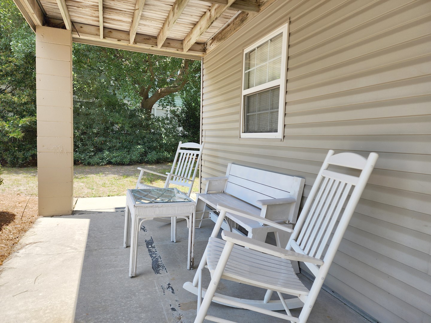 Covered Area Under Home with Rocking Chairs