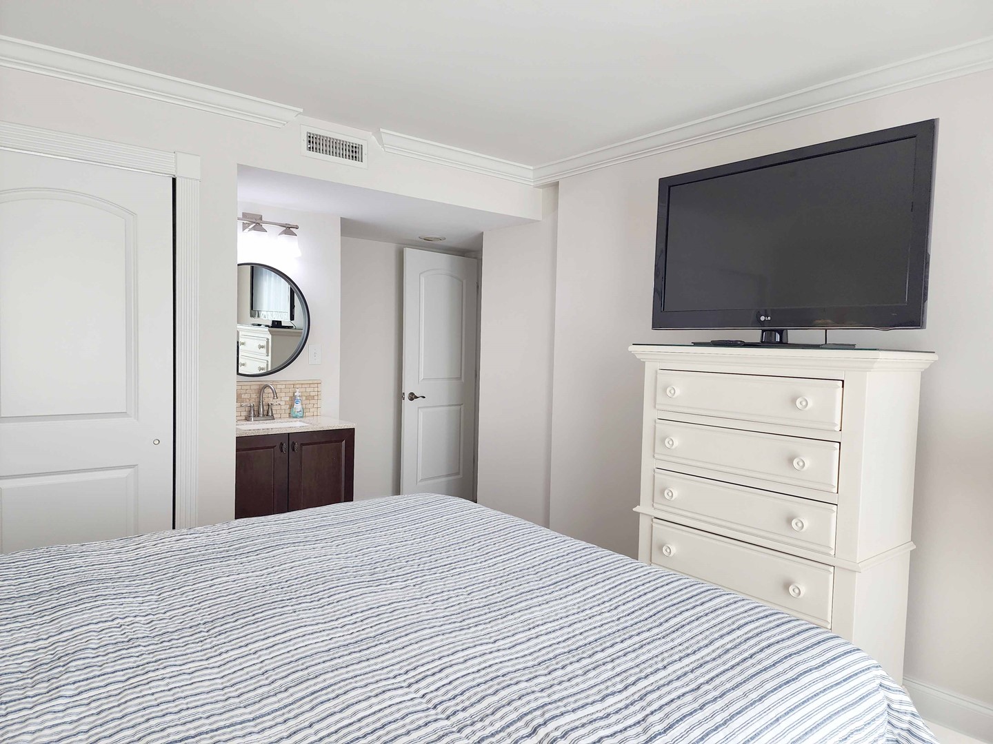 TV and Private Vanity in Bedroom 2