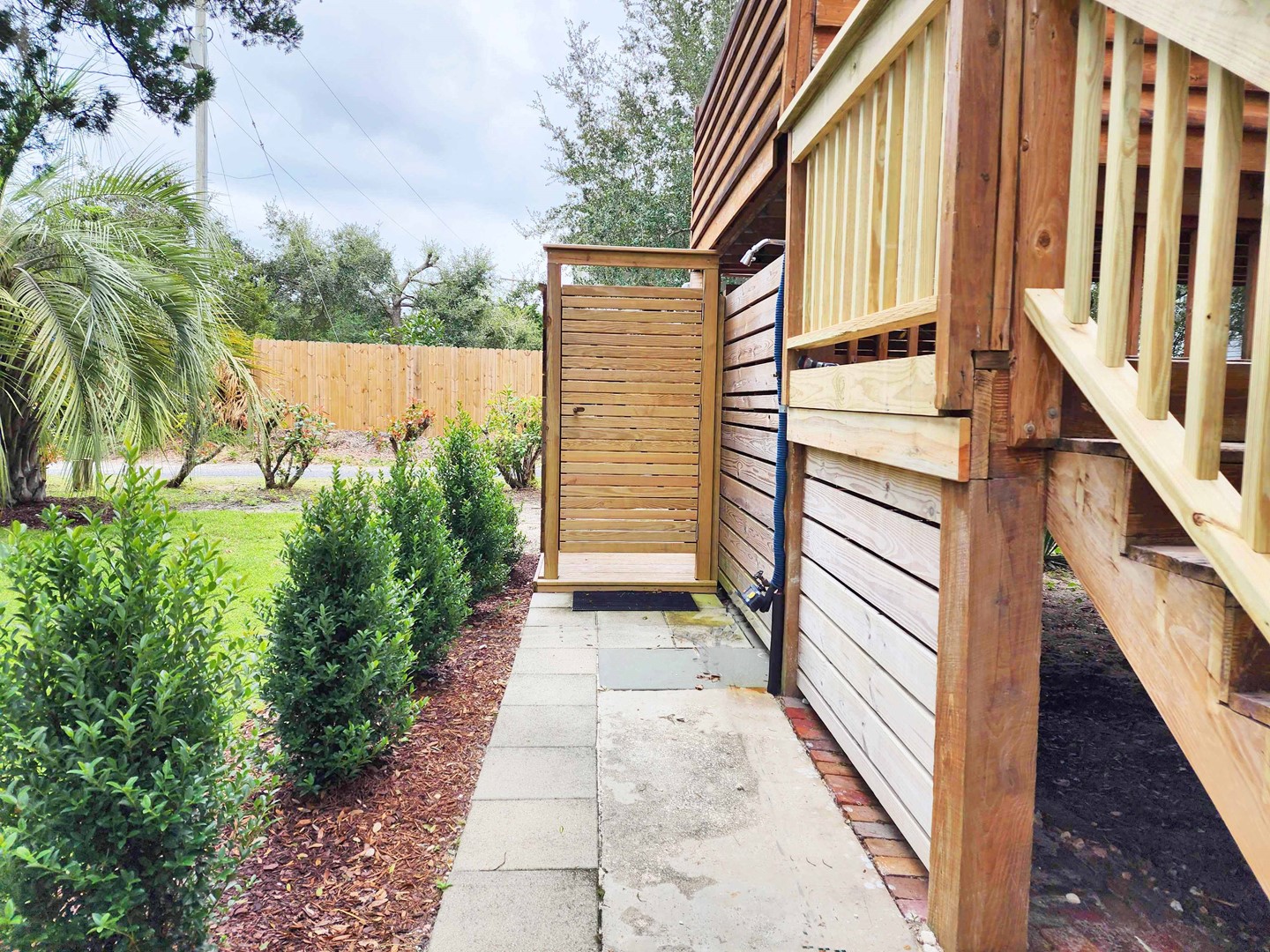 Enclosed Outside Shower & Open Rinse Shower